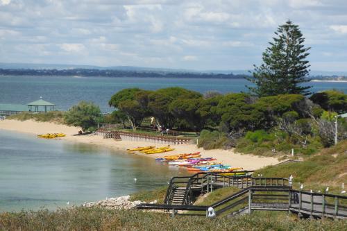 Looking down at all the kayaks on the beach and gazebo and over to the mainland.