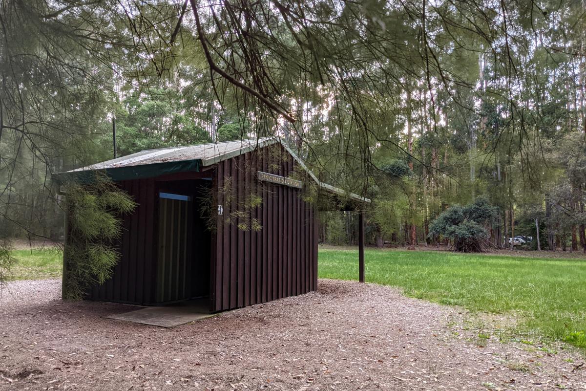 Small wooden building - registration station and toilets at Greens Island Campground
