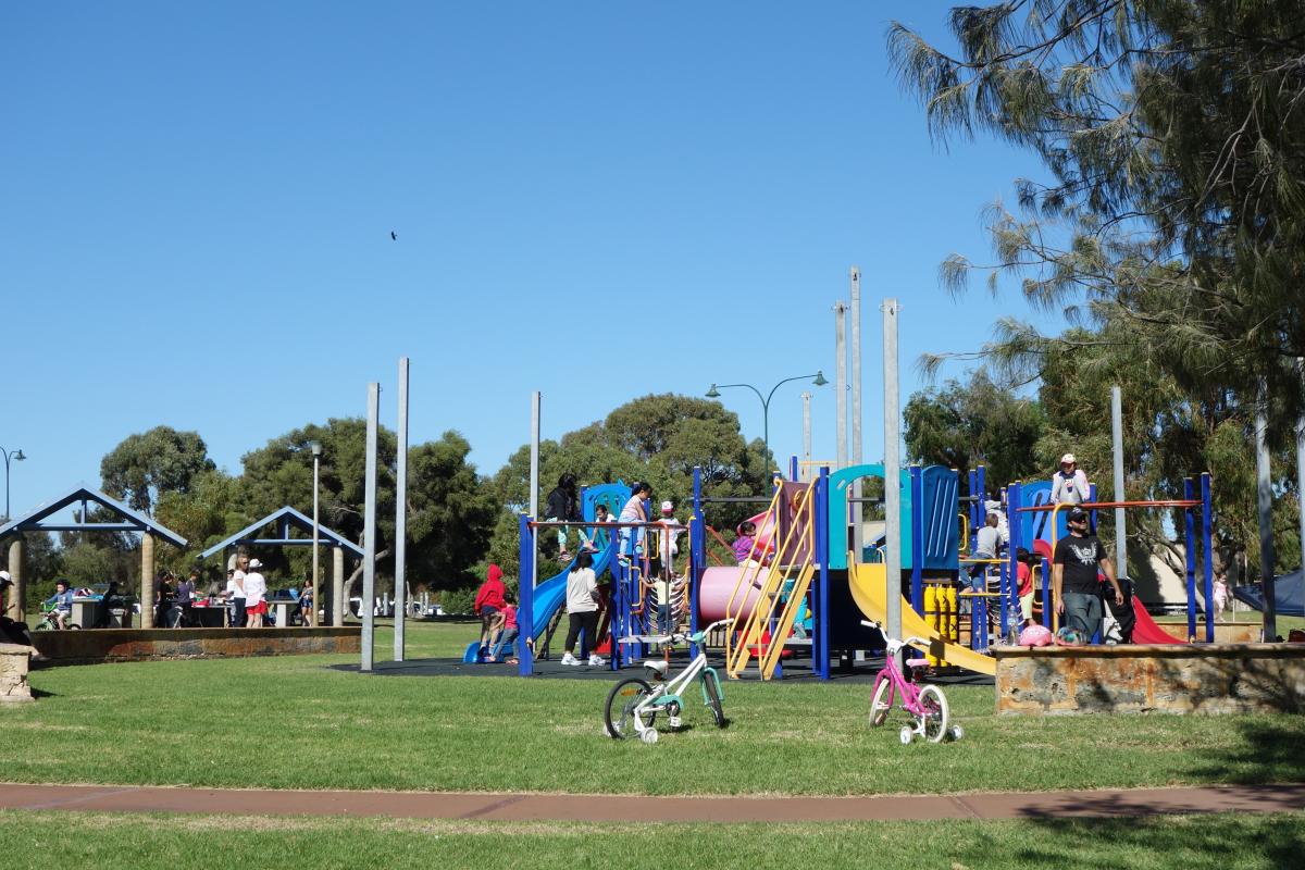 Children enjoy the playground, extensive grass area and sealed paths at John Graham Reserve.